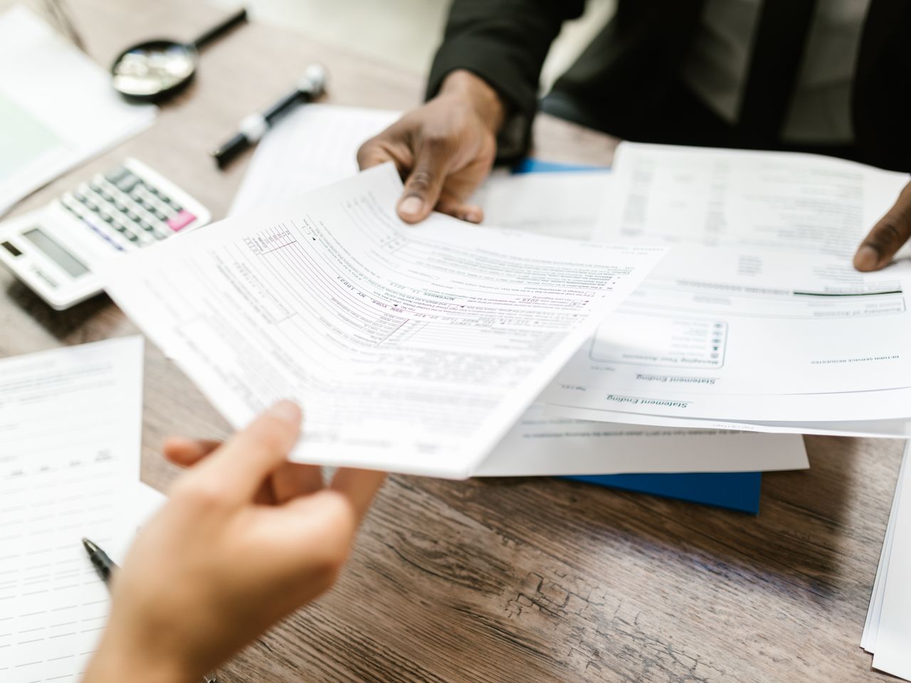 Two counterparties exchanging financing documents during a capital placement review